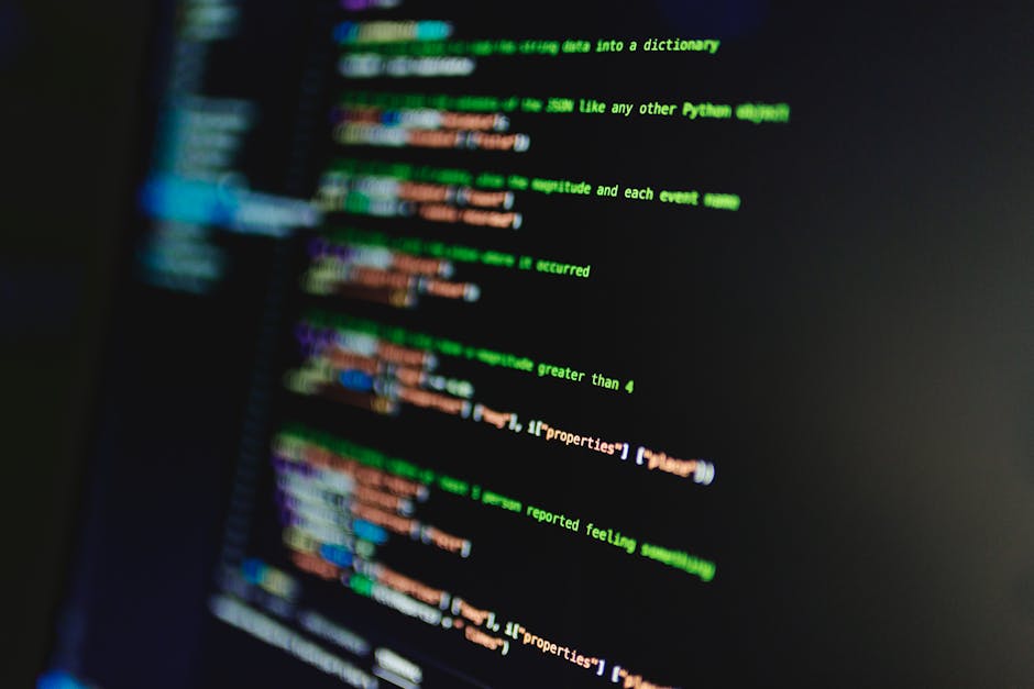 How BPO and Software Outsourcing Can Accelerate Your Digital Transformation - Laptop displaying code with reflection, perfect for tech and programming themes.